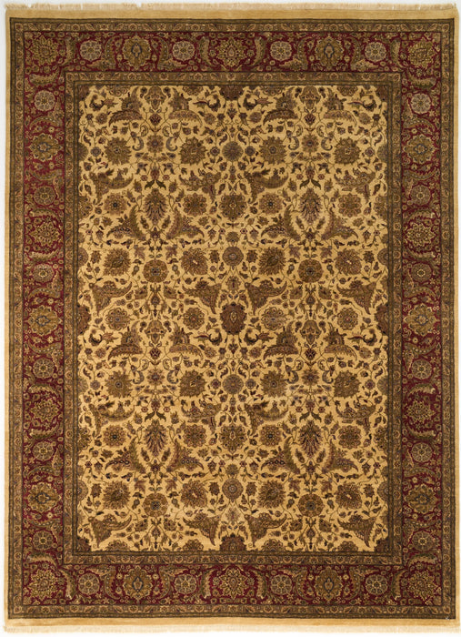 An ornate traditional area rug with a central field of beige and brown floral motifs, surrounded by a dark red and green patterned border.