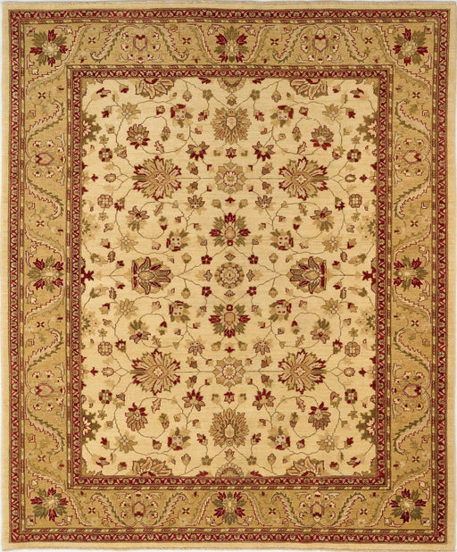 An oriental-style area rug with a cream center field, decorated with intricate floral and vine motifs in rust red, olive green, and tan, surrounded by a wide decorative border.